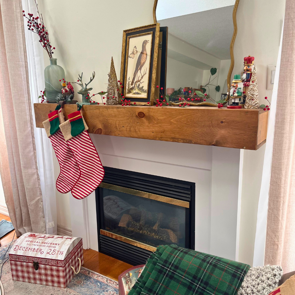 An Early American stained handmade fireplace mantel slipcover is featured with christmas decorations.