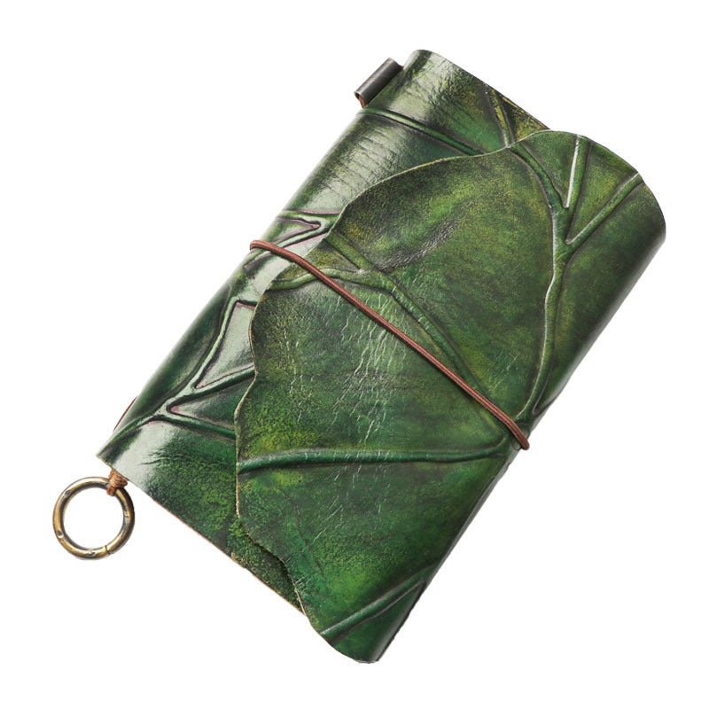 Leather leaf wrapped notebook. A green, natural lembas bread wrap leaf around a classic blank note paper.