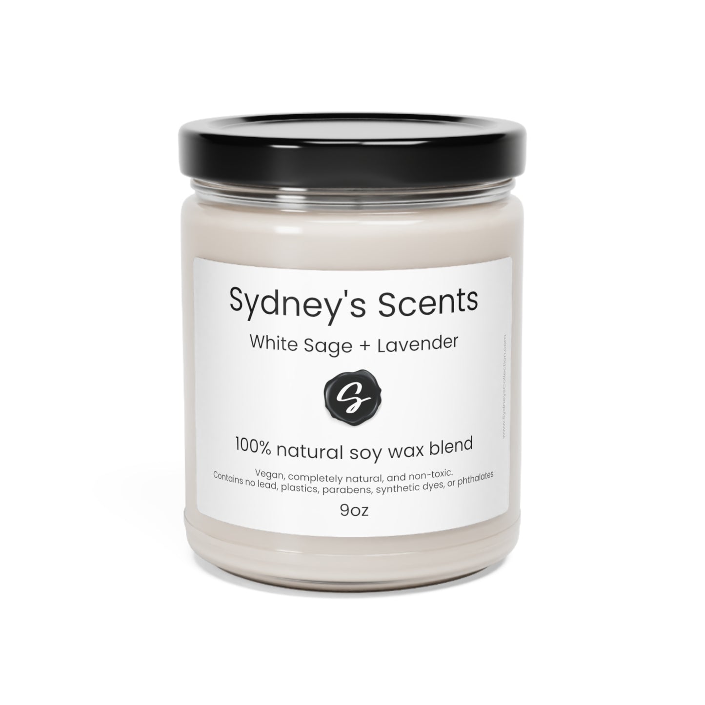 A luxurious glass jar soy candle is lit, the scent featured is white sage and lavender.