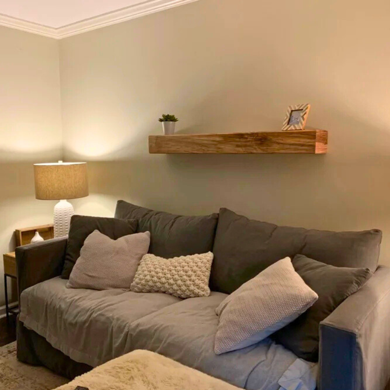 Handmade Canadian Maple rustic box floating shelves are displayed in a living room.