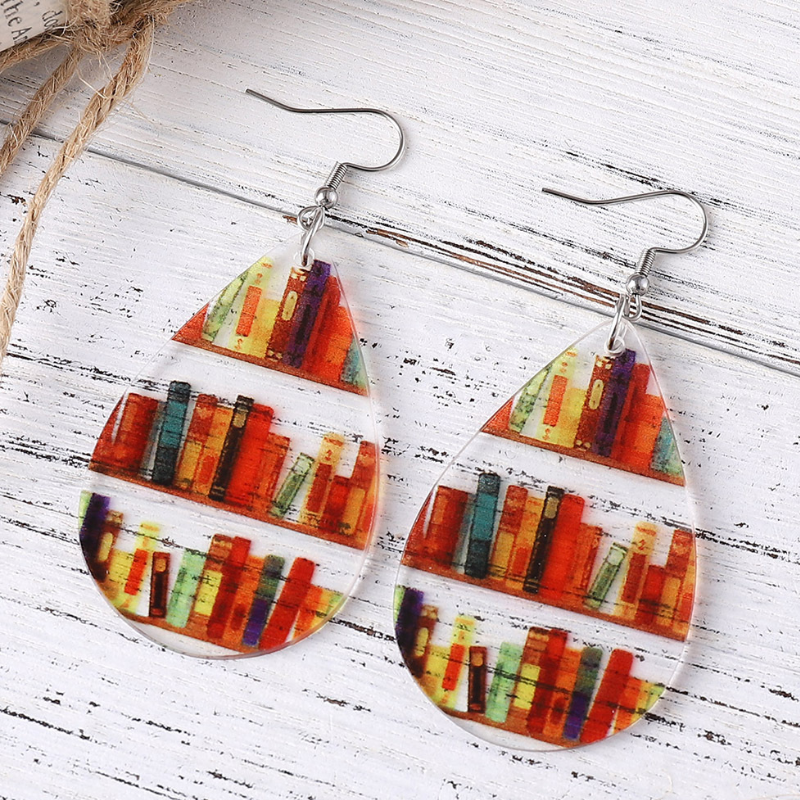 Colourful acrylic mini bookshelf earrings in available teardrop, heart, arch, and circular shapes.