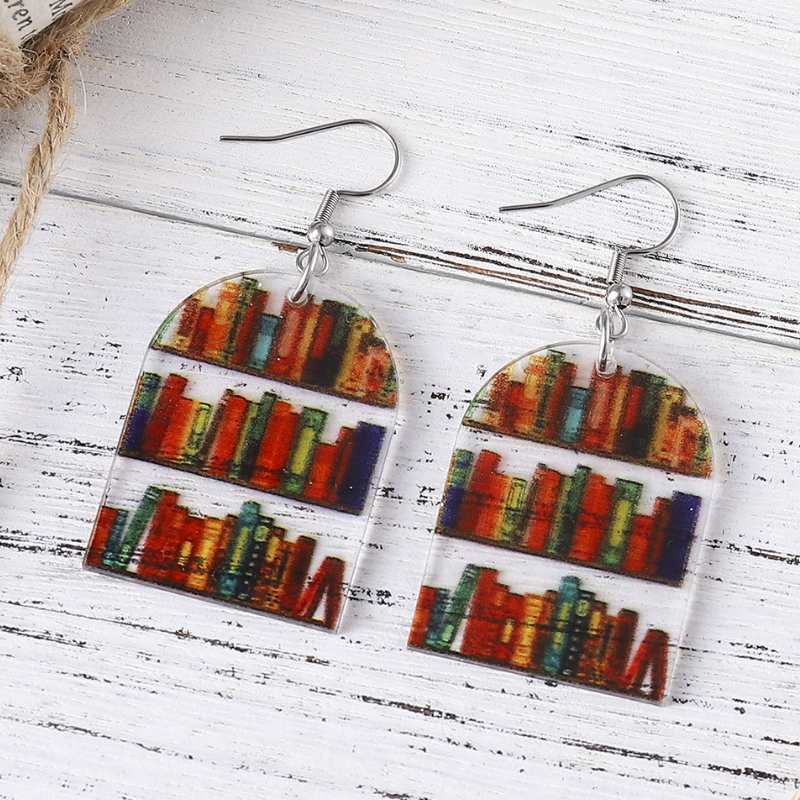 Colourful acrylic mini bookshelf earrings in available teardrop, heart, arch, and circular shapes.