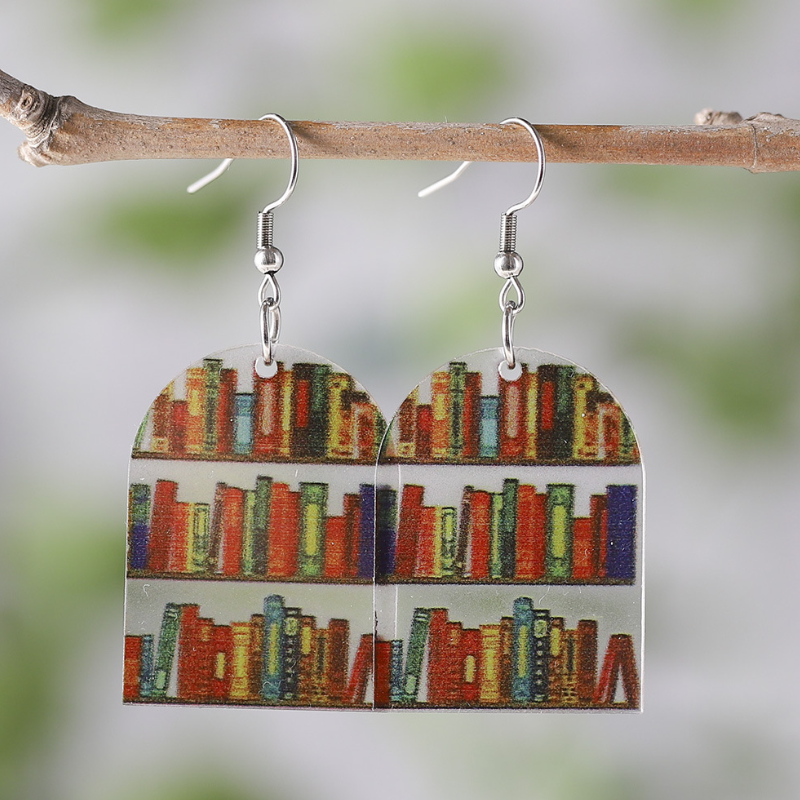 Clear acrylic arch shaped mini bookshelf earrings with colourful books inside.