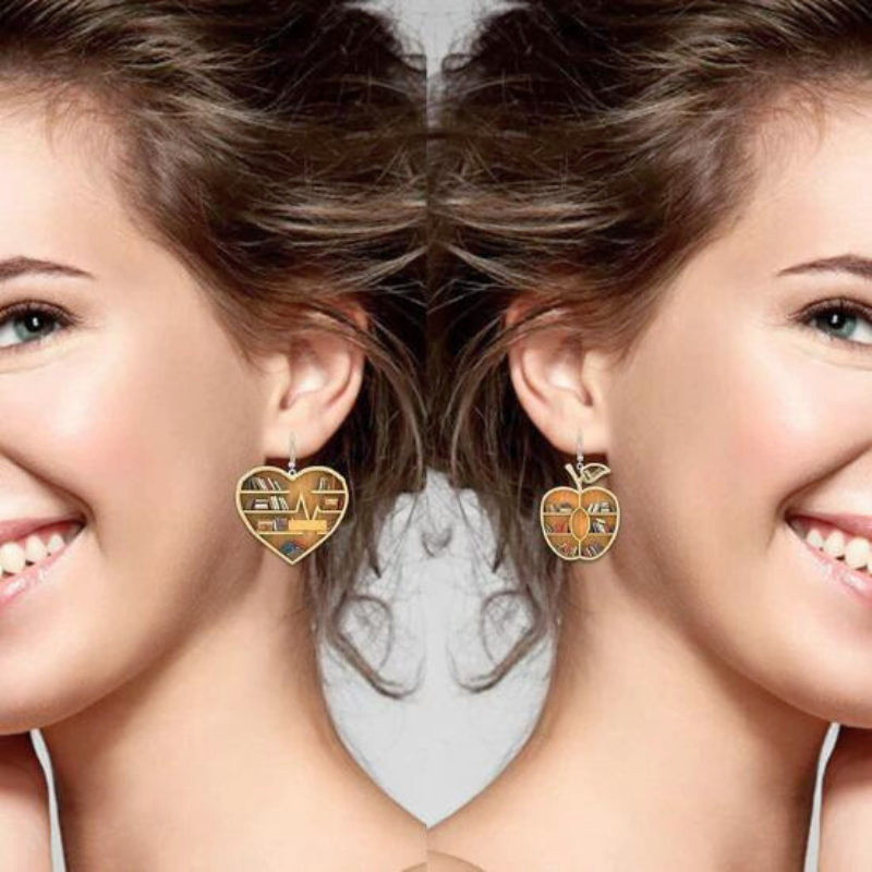 Mini Bookshelf earrings are showcased on an attractive model.