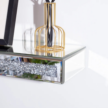 Mirrored glass crystal fireplace mantel with a reflective luxurious frame. For use as a mantel, or luxury floating shelf.