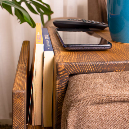 A solid wood handmade stained couch caddy, finished with gloss.  A rustic and truly handmade wooden armrest available in thin and wide options. Multiple sizes and stains are available, the standard size is shown.