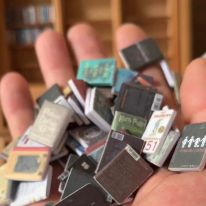 Close up image of the best books for the Anxiety Bookshelf are held in a hand.