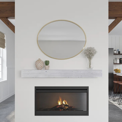 A white mantel slipcover floats on a wall overtop a fireplace.