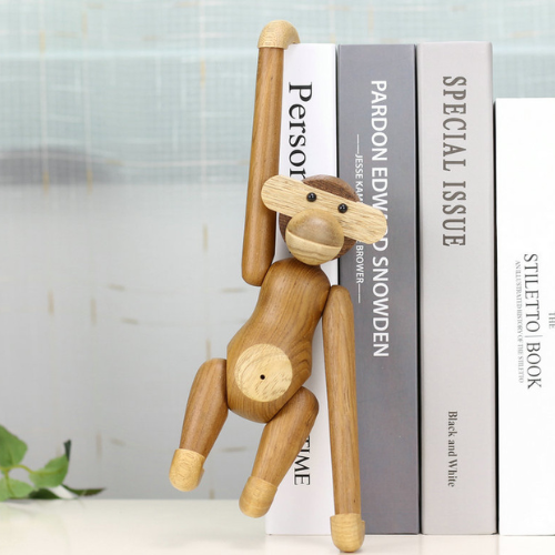 Handmade poseable wood monkey figurine made from teak and limba.