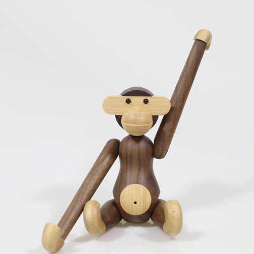 Handmade poseable wood monkey figurine made from teak and limba.