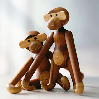 Handmade poseable wood monkey figurine made from teak and limba.