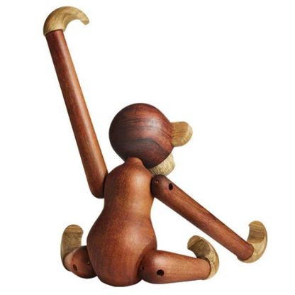 Handmade poseable wood monkey figurine made from teak and limba.