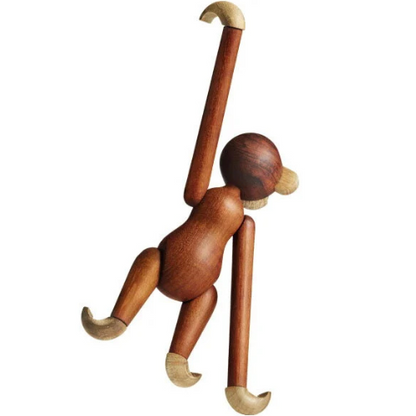 Handmade poseable wood monkey figurine made from teak and limba.