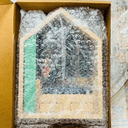 Anxiety Book Room miniature bookshelf boxed with bubble wrap for protection.