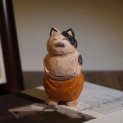 Hand carved cat with pants ornaments stands on its hind legs and faces the camera. The cutest gifts for cat lovers and cat ladies.