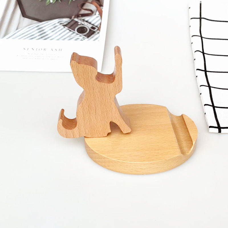 Wood animal shaped phone stand in the form of a sitting cat, showcasing natural wood design and functionality.