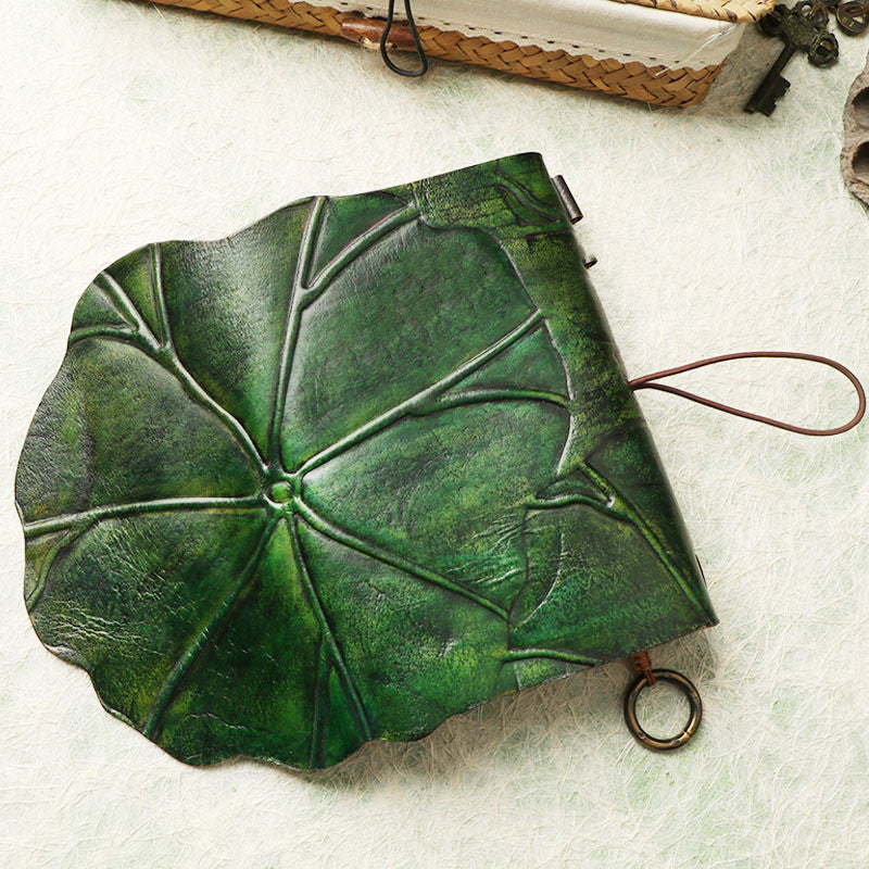 Leather leaf wrapped notebook. A green, natural lembas bread wrap leaf around a classic blank note paper.