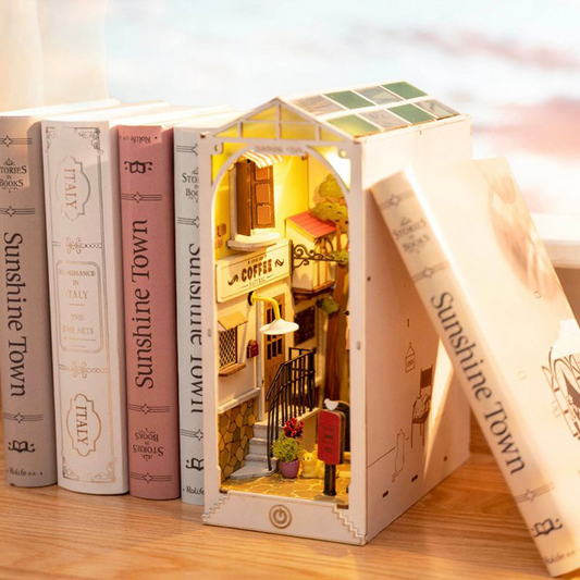 Illuminated book nook displayed inserted between books