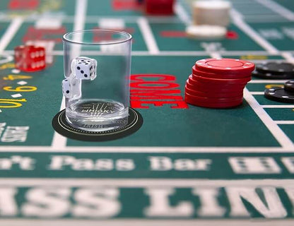 Close-up of a Dice Embedded Hand Blown Glass Cup on a casino table with chips and dice.