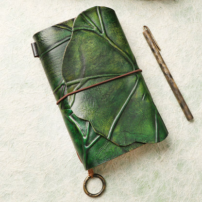 Leather leaf wrapped notebook. A green, natural lembas bread wrap leaf around a classic blank note paper.