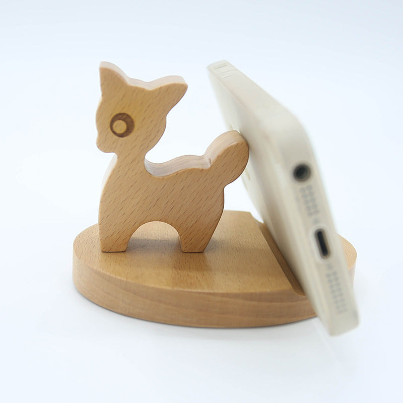 Wood animal shaped phone stand featuring a cute deer design, perfect for holding your phone upright.