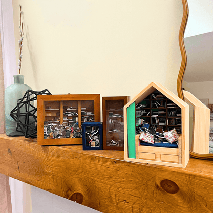 Four Piece Anxiety Bookshelf Collection bundled on a wooden shelf with decorative items.