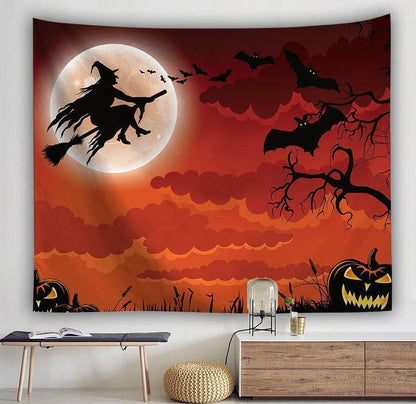 Halloween witch silhouette tapestry with orange sky, moon, bats, and pumpkins, perfect for spooky decor.