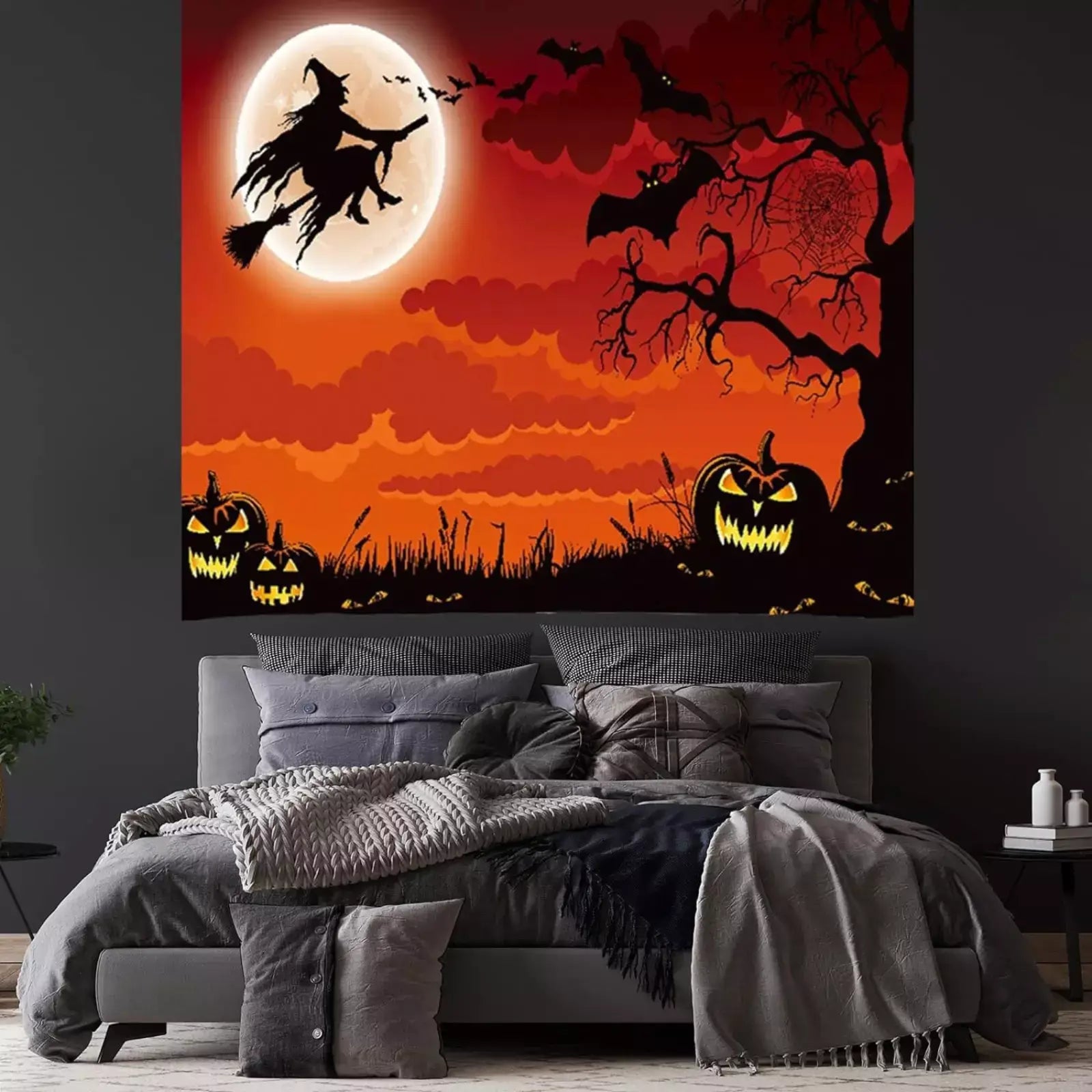 Halloween witch silhouette tapestry with spooky moon, pumpkins, and bats in vibrant orange sky.