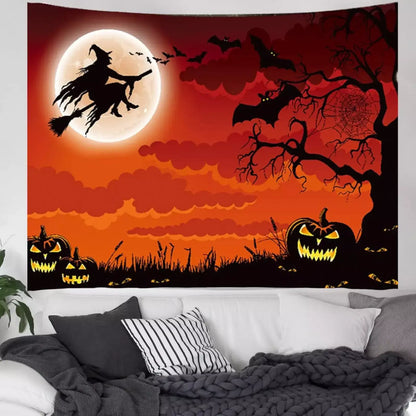 Halloween witch silhouette tapestry against an orange sky with bats, pumpkins, and a full moon.