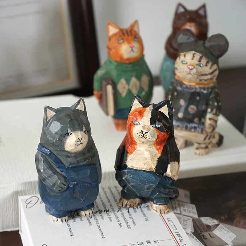 Hand carved cat ornaments stand on their hind legs and face the camera. The cutest gifts for cat lovers and cat ladies.