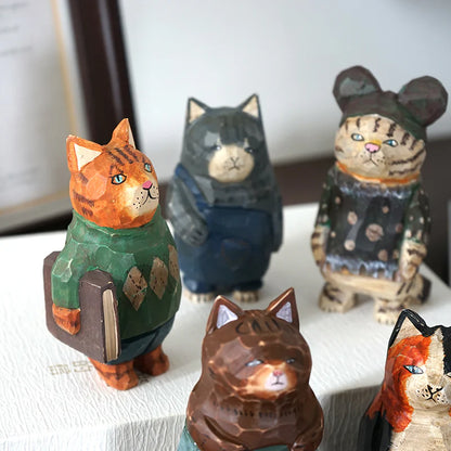 Hand carved cat ornaments stand on their hind legs and face the camera. The cutest gifts for cat lovers and cat ladies.