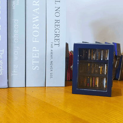 The blue mini Pocket Anxiety Bookshelf mini antique bookcase with a clear display cover which opens to display mini books.
