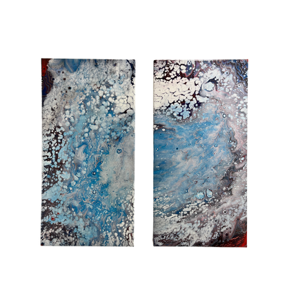 fluid art pour painting diptych that resembles a hurricane 