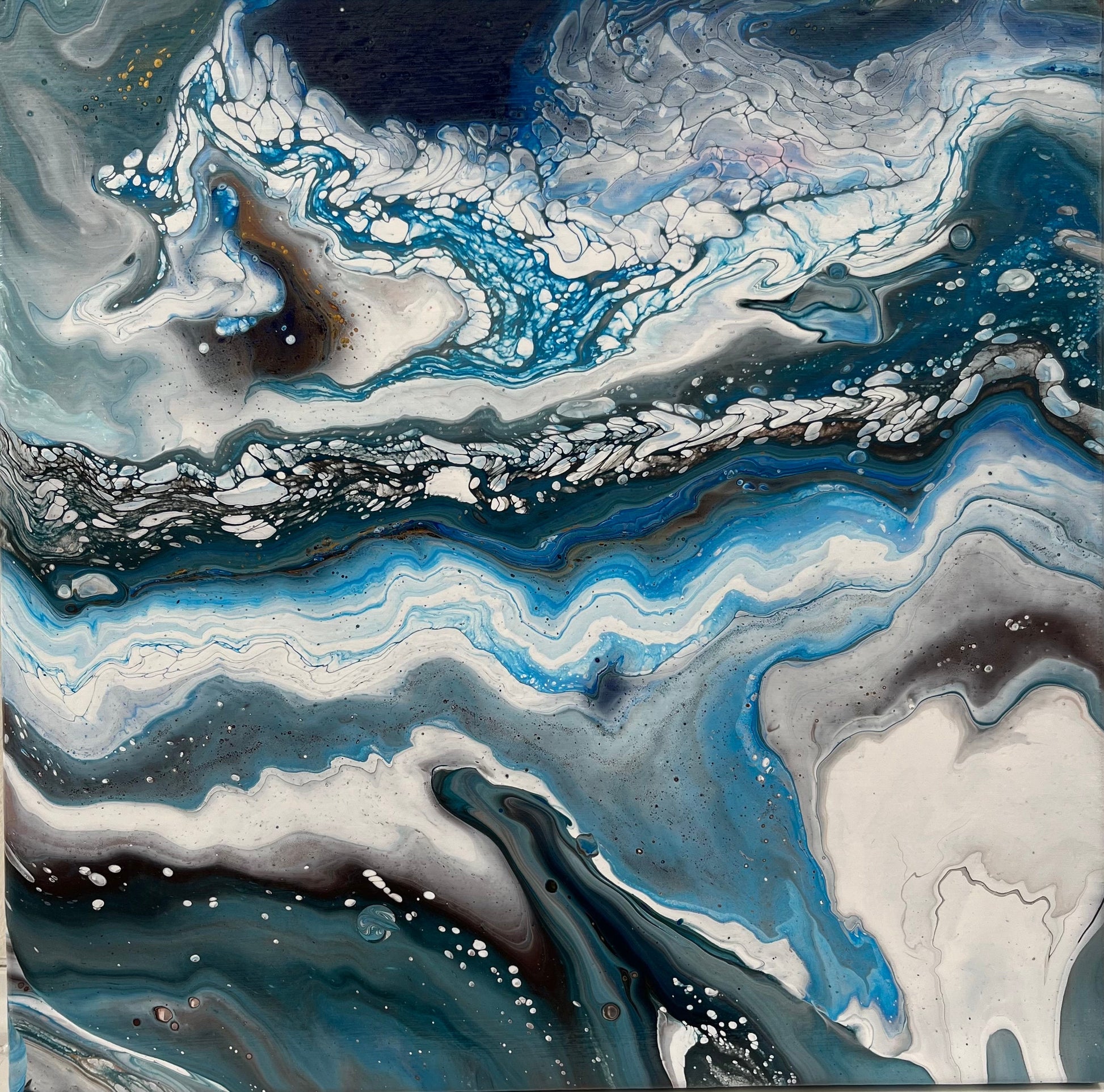 black, white, and blue fluid acrylics creating an icy abstract landscape