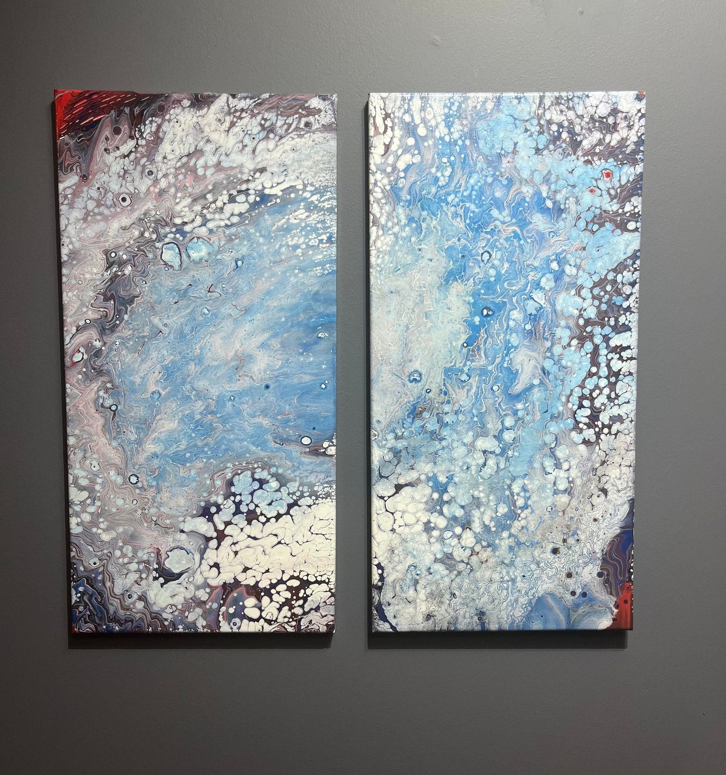 fluid art pour painting diptych that resembles a hurricane 