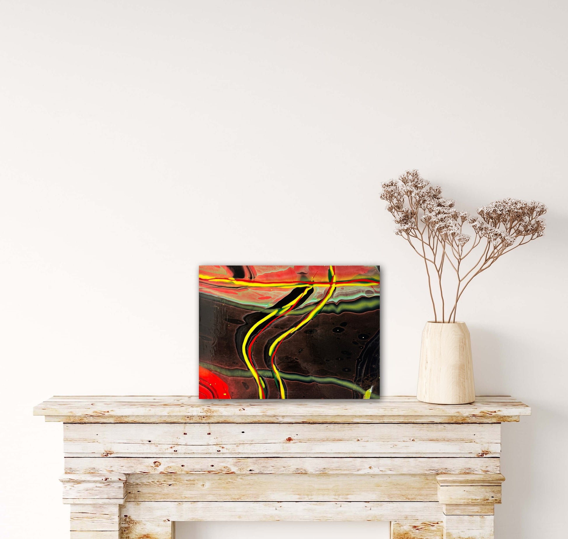 abstract fluid art featuring a black background, with yellow, red and green flowing lines