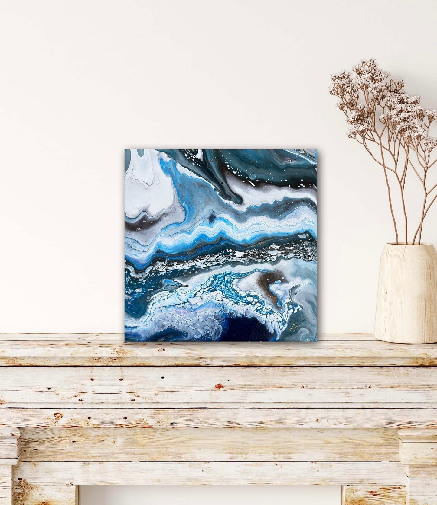 black, white, and blue fluid acrylics creating an icy abstract landscape