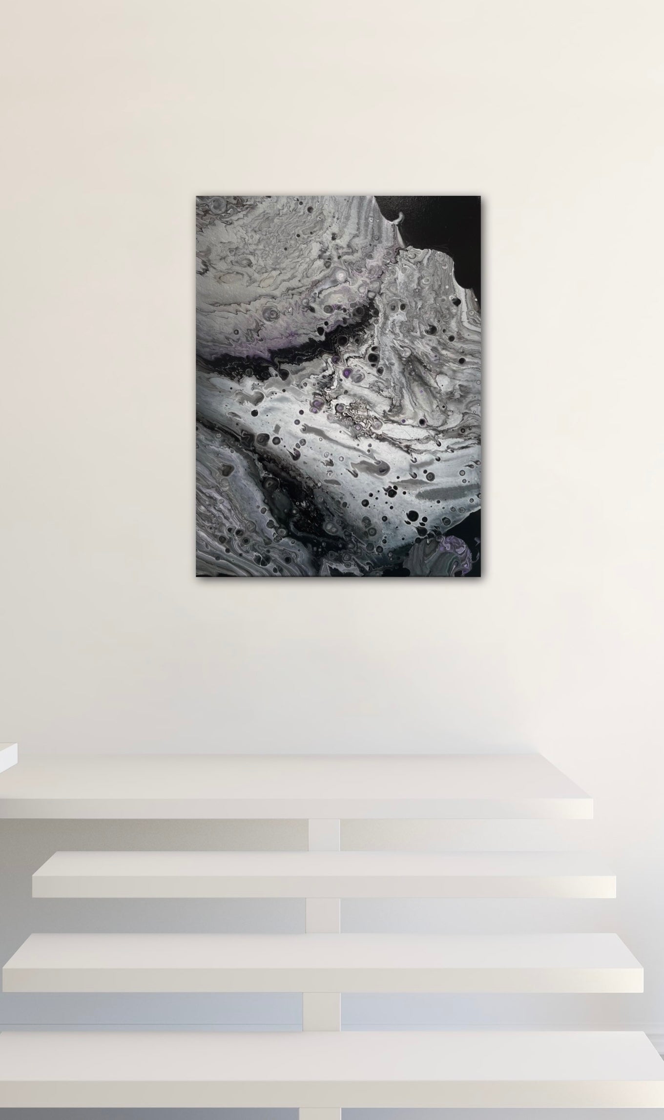 abstract moonscape painting on dsplay, several size options available. Abstract fluid artwork resembling a lunar surface.