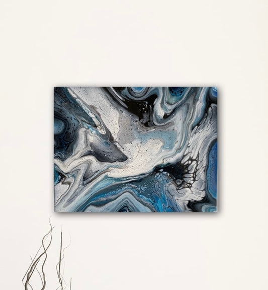 black, white and blue create an abstract angel on this fluid art painting