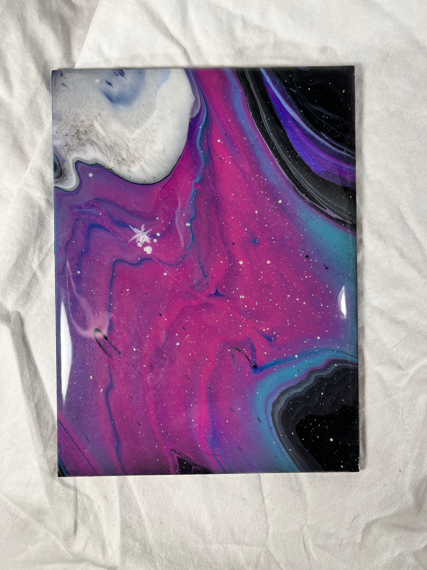 ceramic tile with an epoxy coating over a galaxy acrylic painting