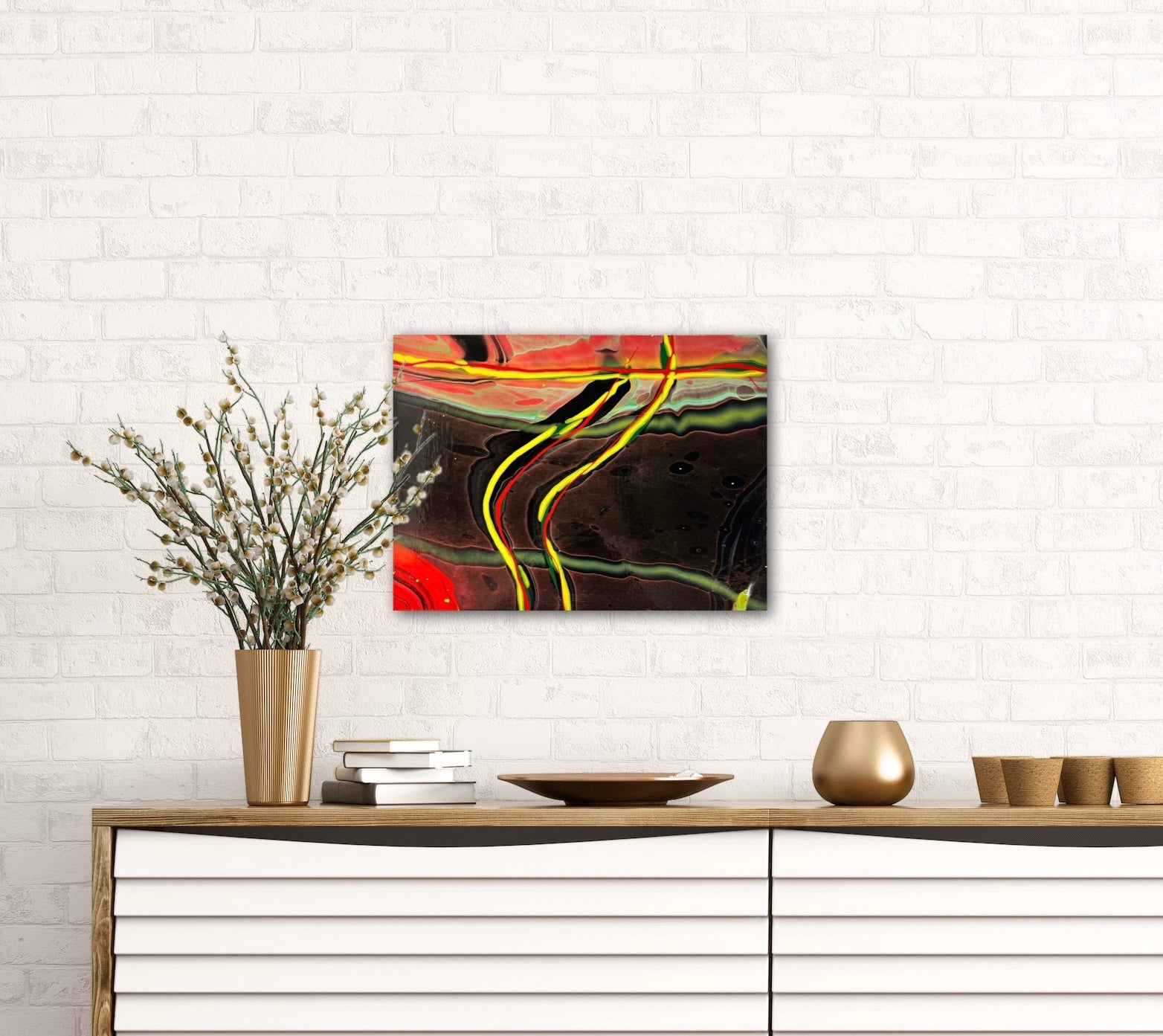 abstract fluid art featuring a black background, with yellow, red and green flowing lines