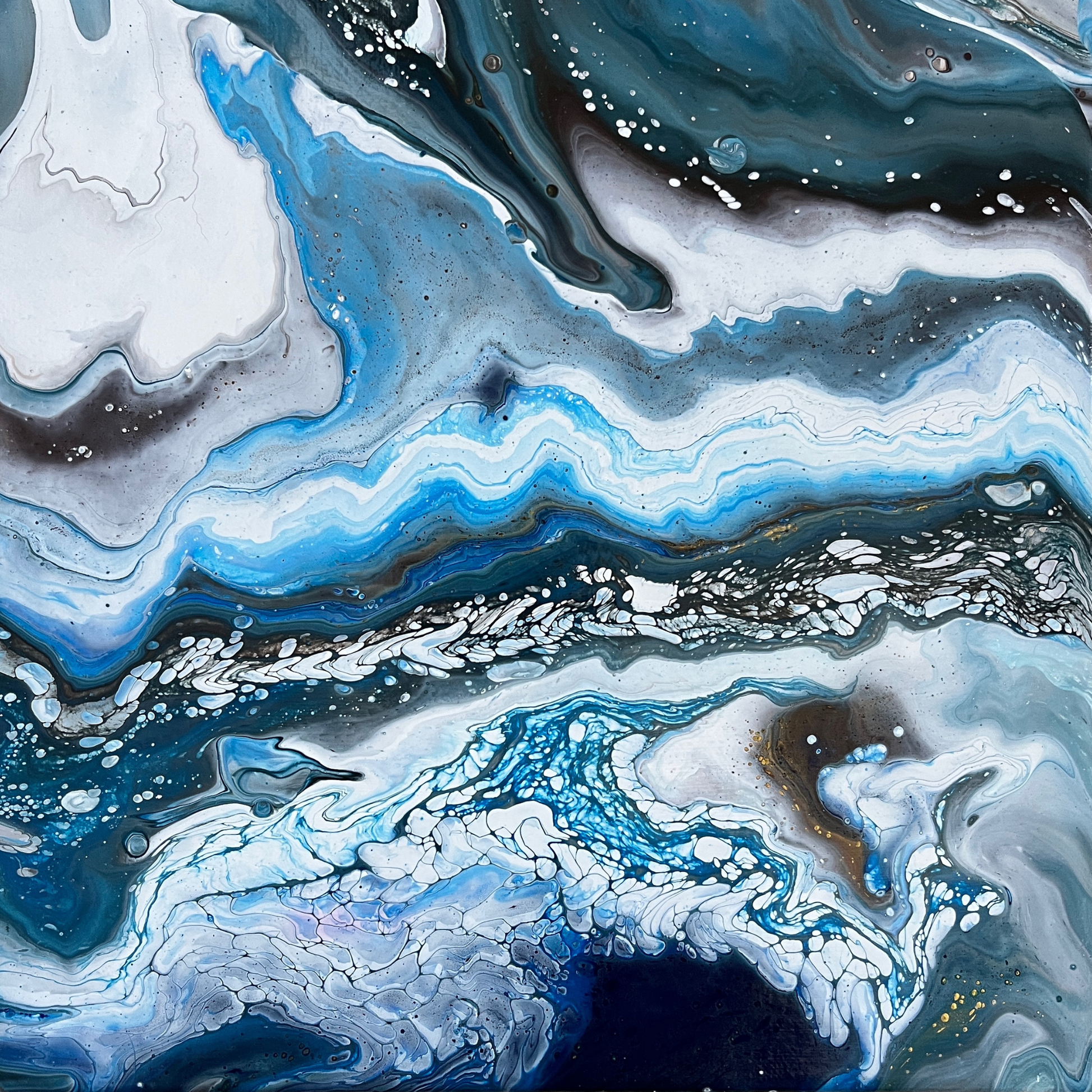 black, white, and blue fluid acrylics creating an icy abstract landscape